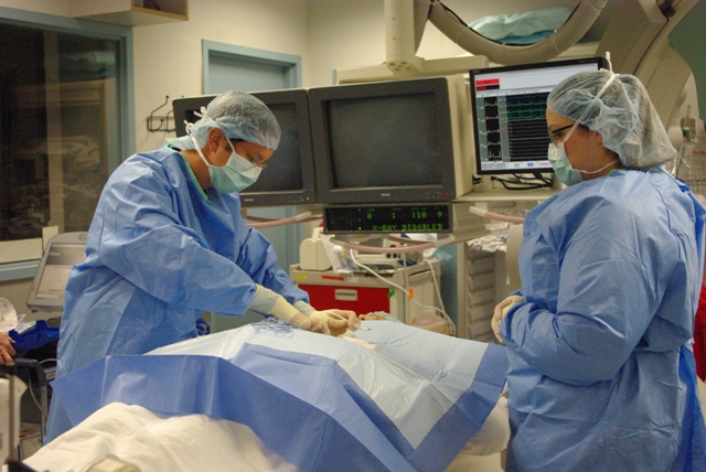 SLUCare electrophysiologist Scott Ferriera, MD, implants the first Reveal Linq device at Saint Louis University Hospital, February 24, 2014.
