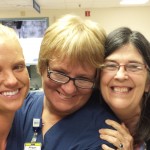 Katie Becht, RN and Susan Kellett, BCC of pastoral care welcome back Maggie Peters, RN, to the halls of 5 North